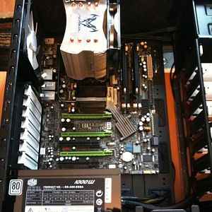 Motherboard, HSF, and PSU in place inside the new case.