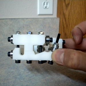 Notice how the bearings constrain the movement of the carriage