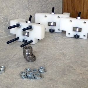 These systems of bearings will constrain the chassis so that it will only travel in a linear motion