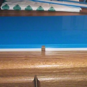 Reverse of the replacement case. It has little clear plastic dots to help keep the keyboard in place. The section added to accommodate the internal bi