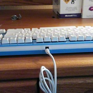 Back side of the assembled keyboard showing the cord outlet.