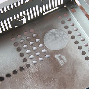 Filling internal holes to give a level surface, mainly to mount the standoffs for the motherboard