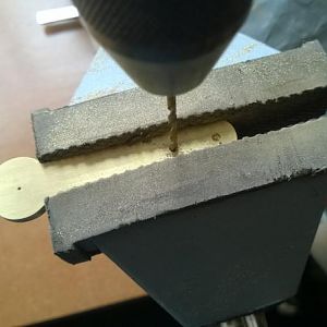 Pilot drilling the holes