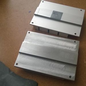 The undersides of the stock heat sink and heat pipe block